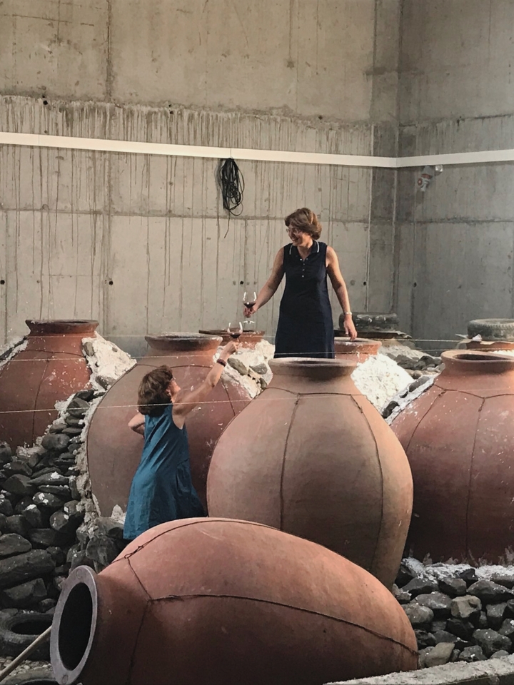 Women in amphora at Nine Oaks Winery Imported by UVA Imports